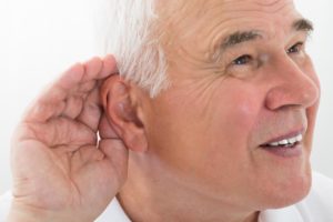 Man experiencing hearing loss